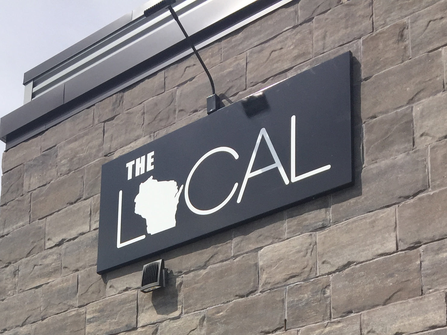 
          
            The Local exterior signage
          
        