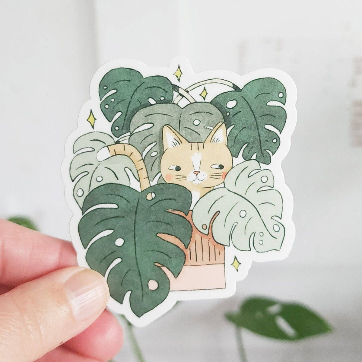 Cat in monstera vinyl sticker