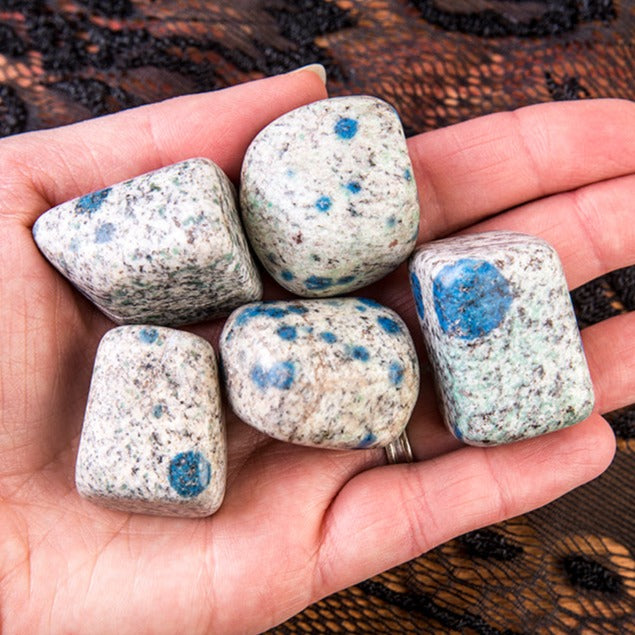 Large K2 Jasper Tumbled Stones in someone&#39;s hand