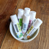 A bowl full of lip balms