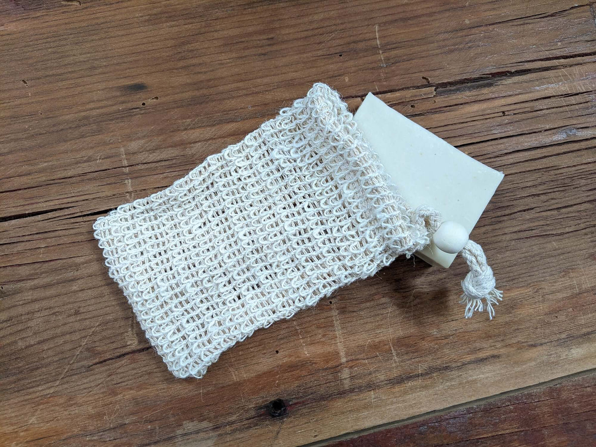 Soap Saver Bag laying on top of soap